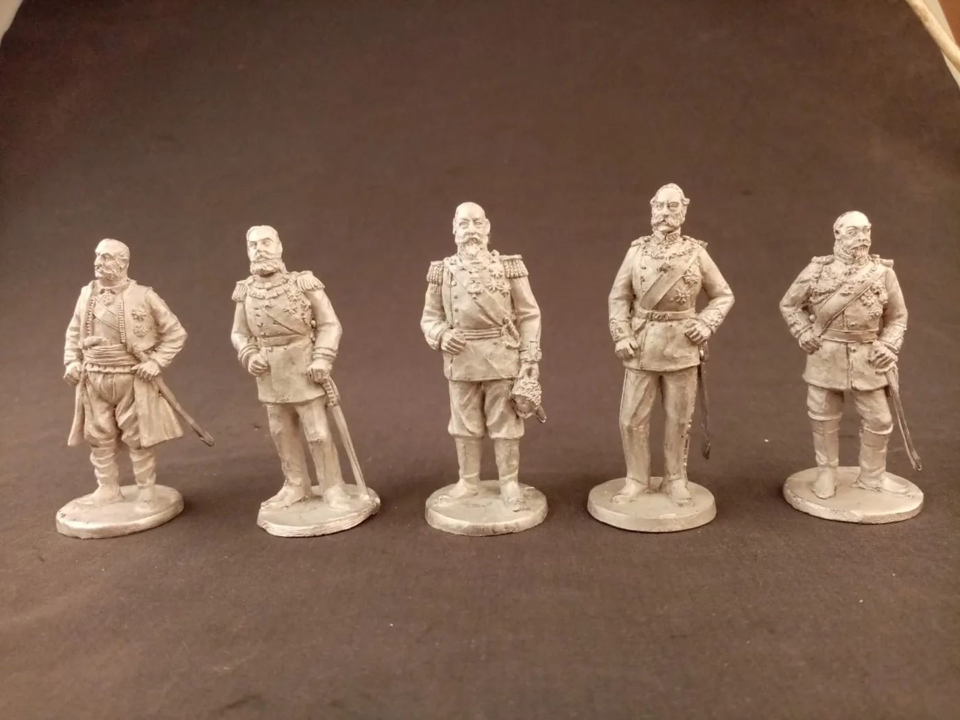 Freshly cast tin figures before painting